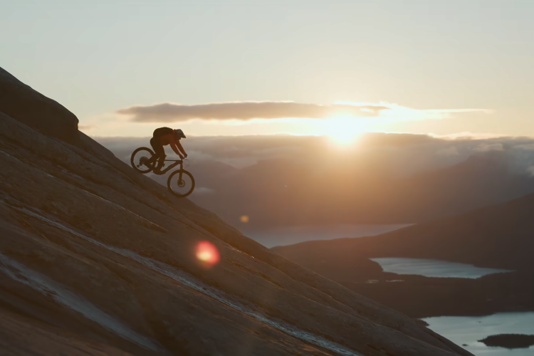 landscape in norway with an mtb rider on ridge